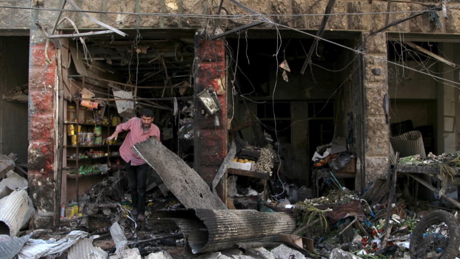 A man inspects damaged shops after an airstrike on a market in the town of Maarat al-Numan in the insurgent stronghold of Idlib province, Syria on April 19, 2016. A man inspects damaged shops after an airstrike on a market in the town of Maarat al-Numan in the insurgent stronghold of Idlib province, Syria on April 19, 2016.
